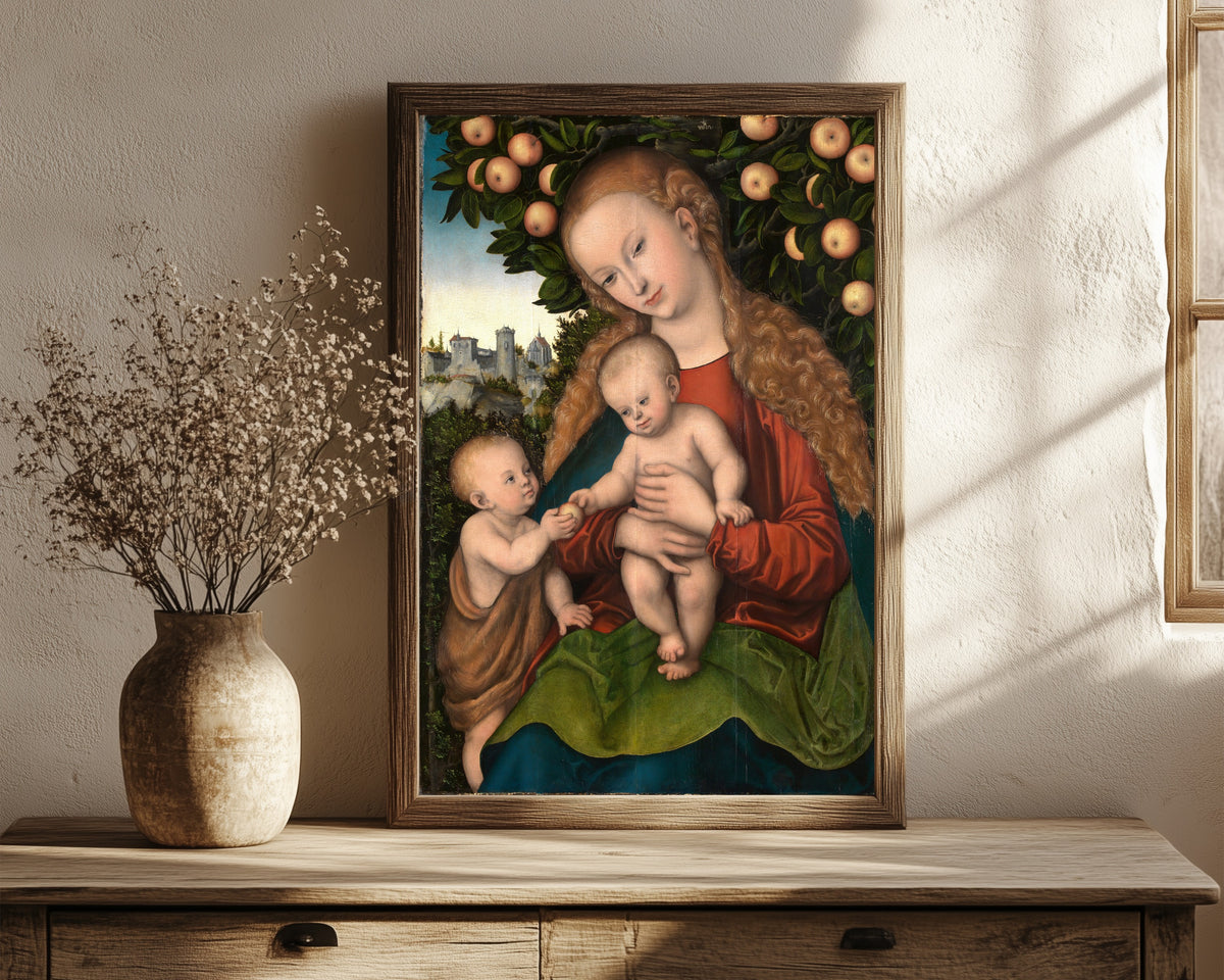 Framed art print of Virgin and Child with Saint John under… by Lucas Cranach the Elder, in a dark wood frame leaning on a rustic console beside dried flowers