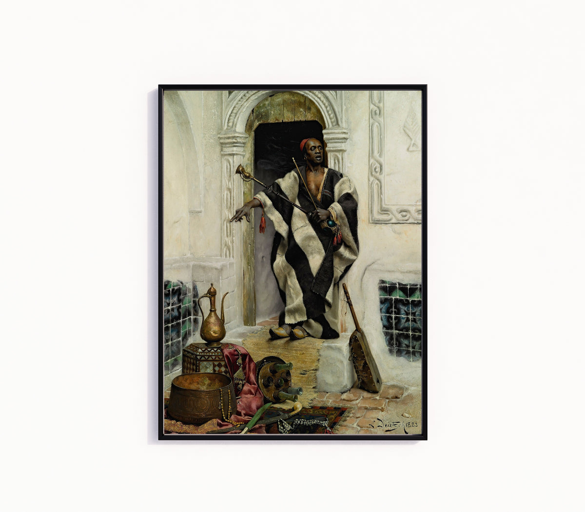 Framed art print of The Della'l by Ludwig Deutsch, in a slim black frame on a plain white wall