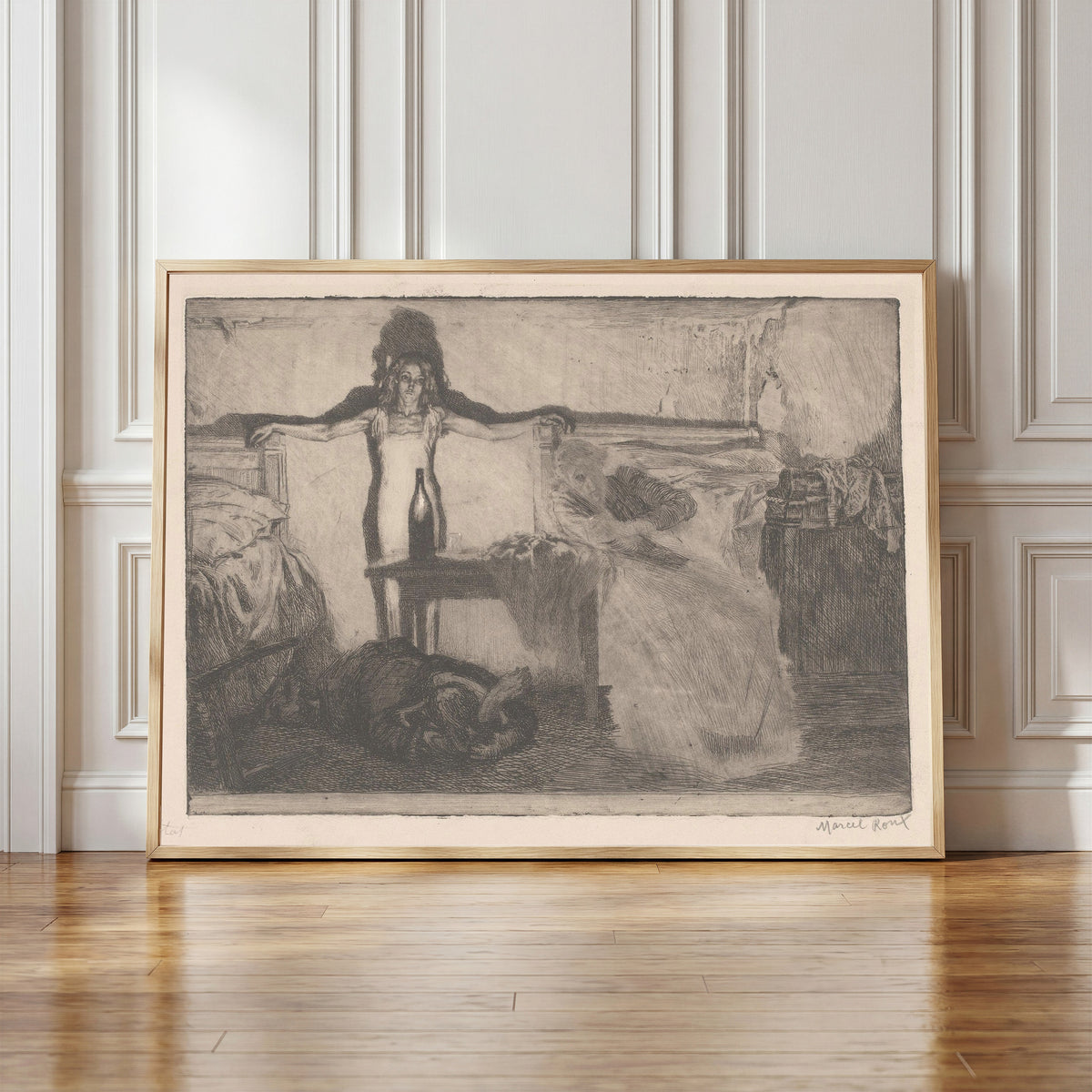 Framed art print of Alcohol by Marcel Roux, in a light wood frame leaning against a panelled white wall