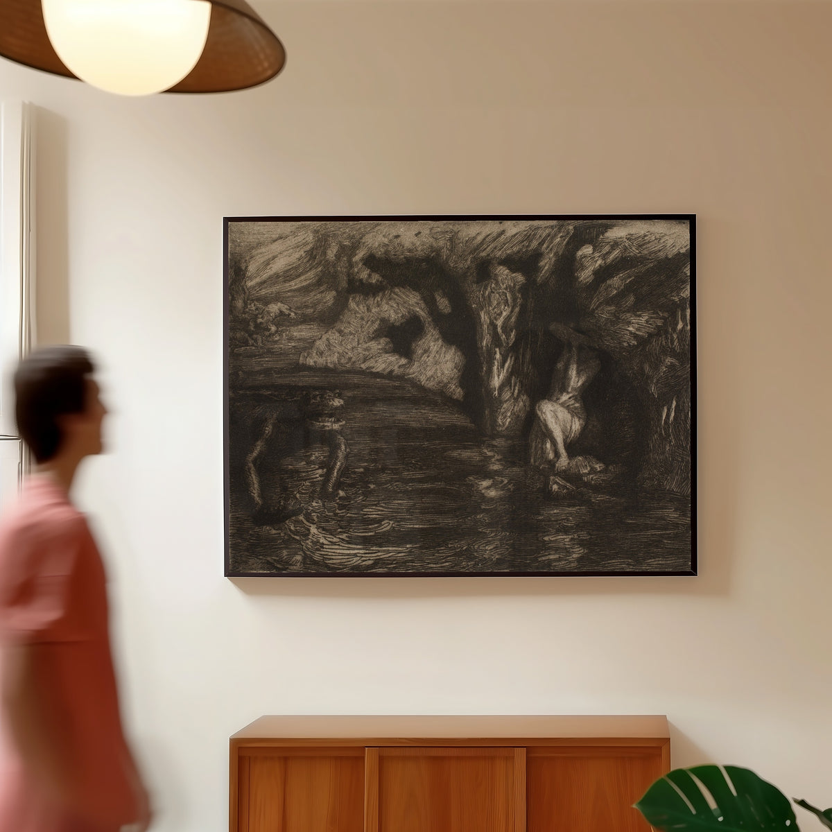 Framed art print of The Monsters by Marcel Roux, in a slim black frame on a warm wall in a sunlit room