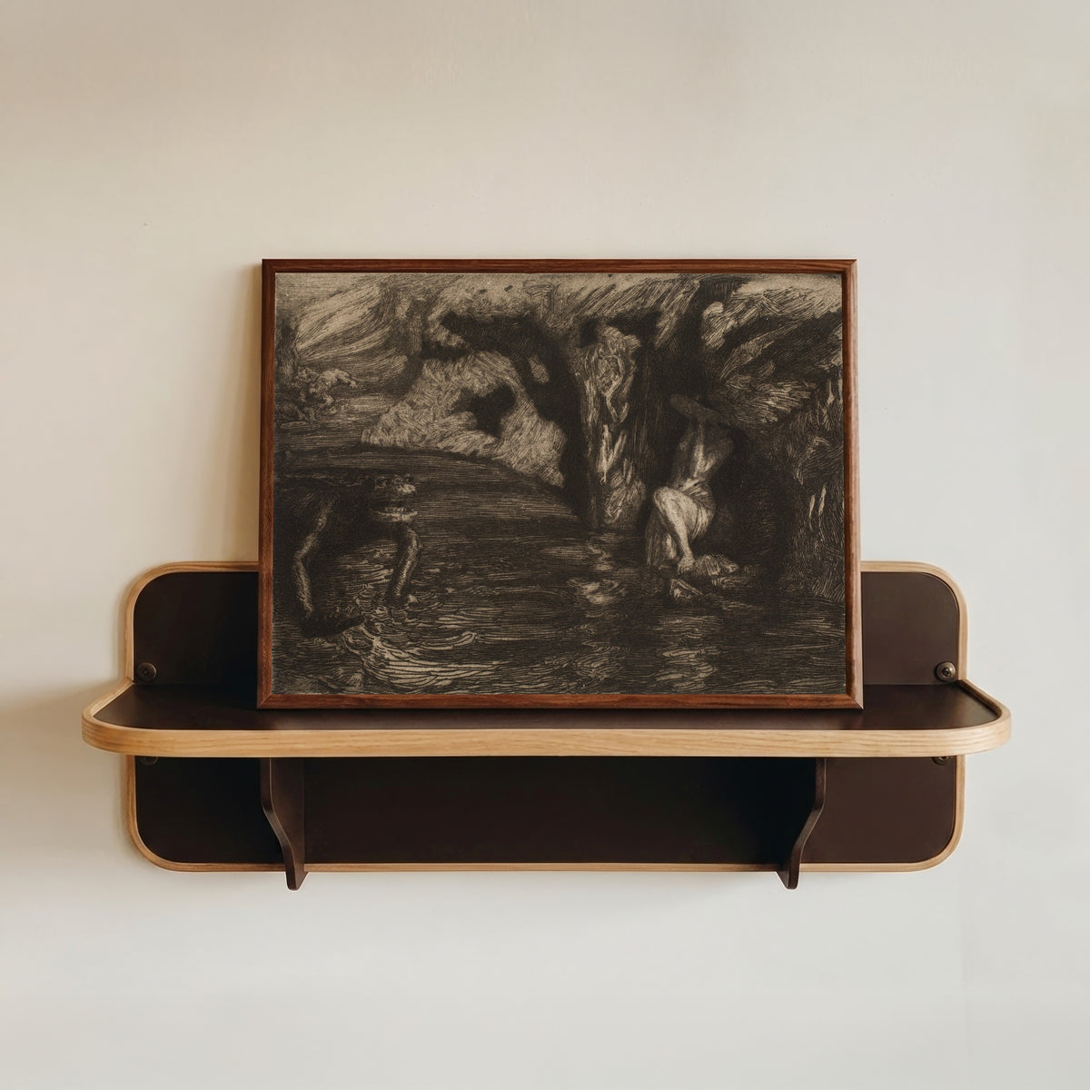 Framed art print of The Monsters by Marcel Roux, in a dark wood frame resting on a wall shelf