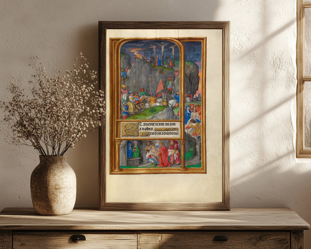 Framed art print of Spinola Hours: The Crucifixion by Master of James IV of Scotland, in a dark wood frame leaning on a rustic console beside dried flowers