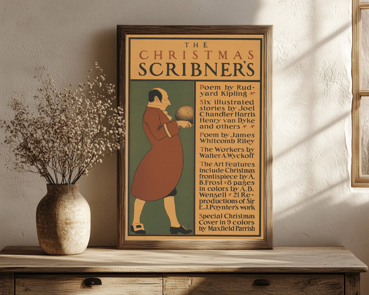 Framed art print of The Christmas Scribner’s by Maxfield Parrish, in a dark wood frame leaning on a rustic console beside dried flowers
