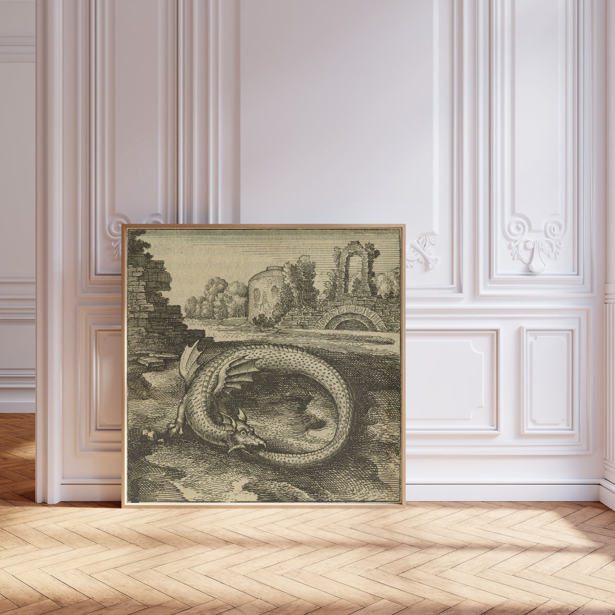 Framed art print of Atalanta Fugiens, Emblem 14: This Is the Dragon That Devours… by Michael Maier, leaning against pale pink panelling on a herringbone floor