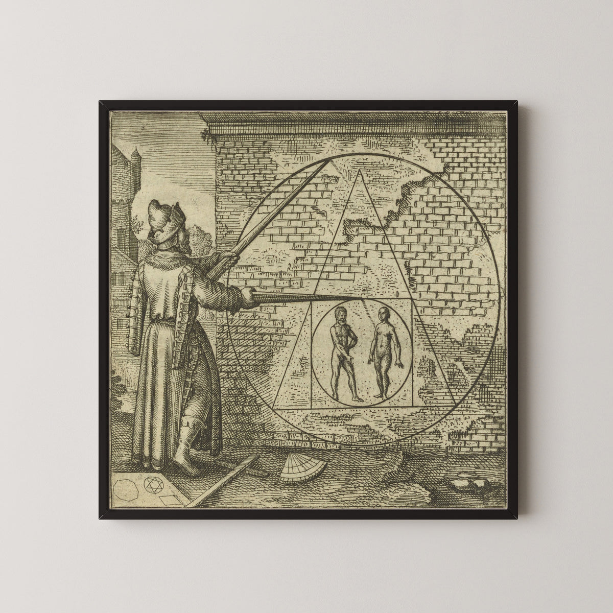 Framed art print of Atalanta Fugiens, Emblem 21: Make a Circle from Man and Woman by Michael Maier, in a black frame on a pale wall