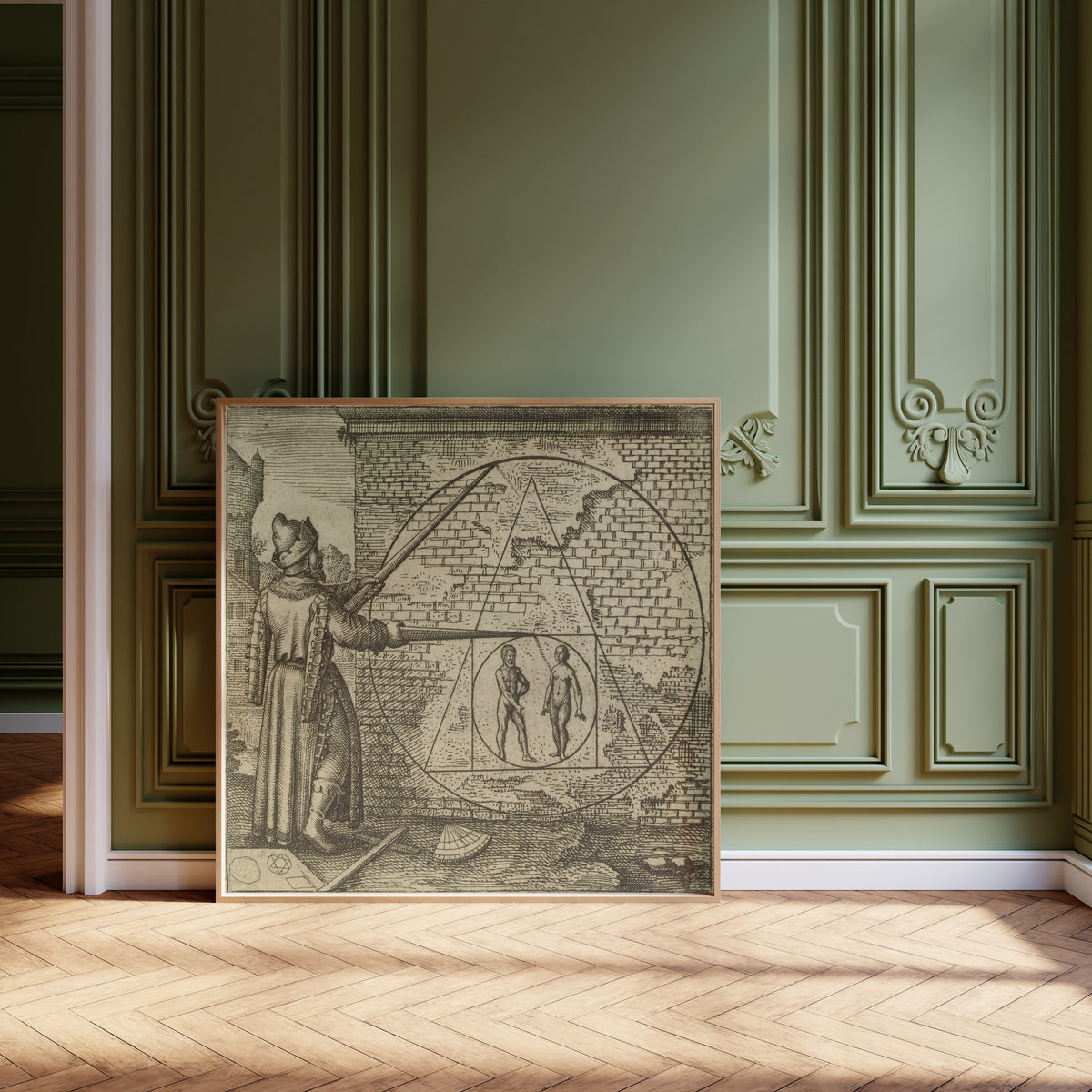 Framed art print of Atalanta Fugiens, Emblem 21: Make a Circle from Man and Woman by Michael Maier, leaning against olive-green panelling on a herringbone floor