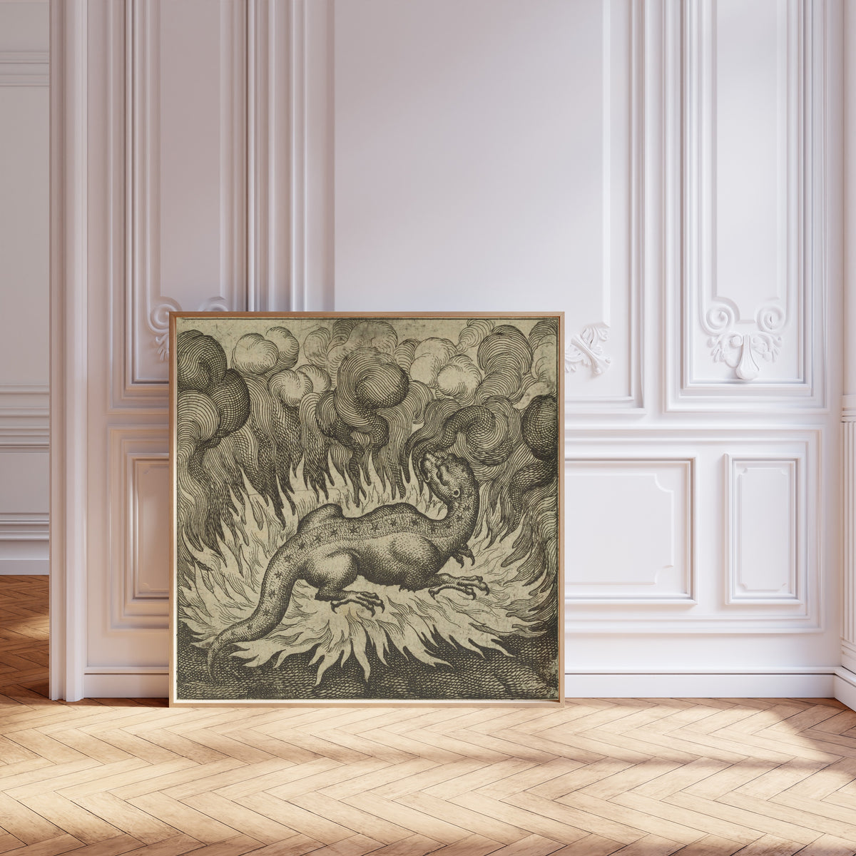 Framed art print of Atalanta Fugiens, Emblem 29: As the Salamander Lives in Fire… by Michael Maier, leaning against pale pink panelling on a herringbone floor