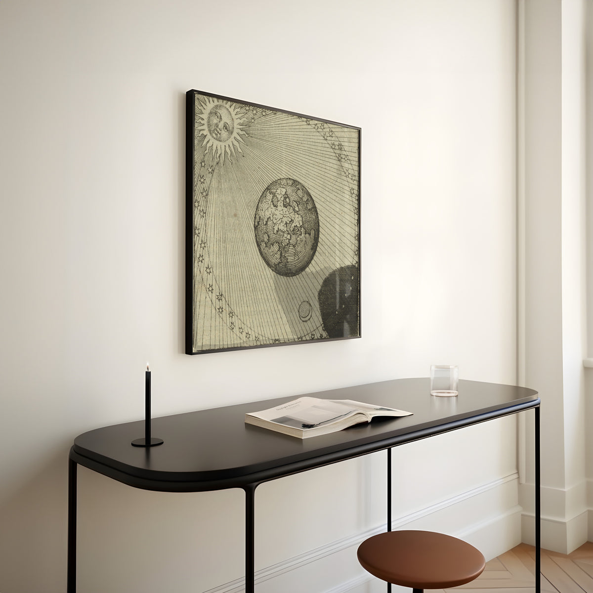 Framed art print of Atalanta Fugiens, Emblem 45: The Sun and Its Shadow Complete the Work by Michael Maier, above a slim black console table