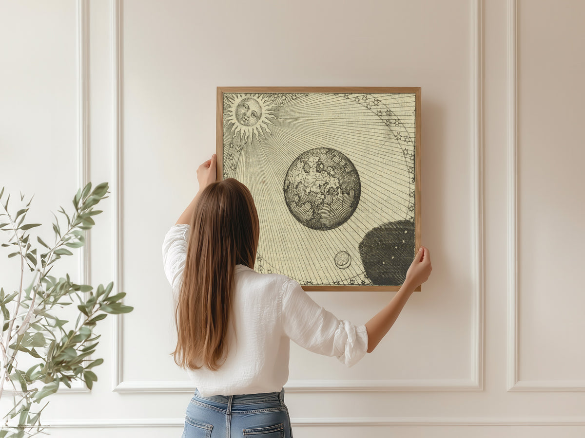 Framed art print of Atalanta Fugiens, Emblem 45: The Sun and Its Shadow Complete the Work by Michael Maier, hung on a panelled wall