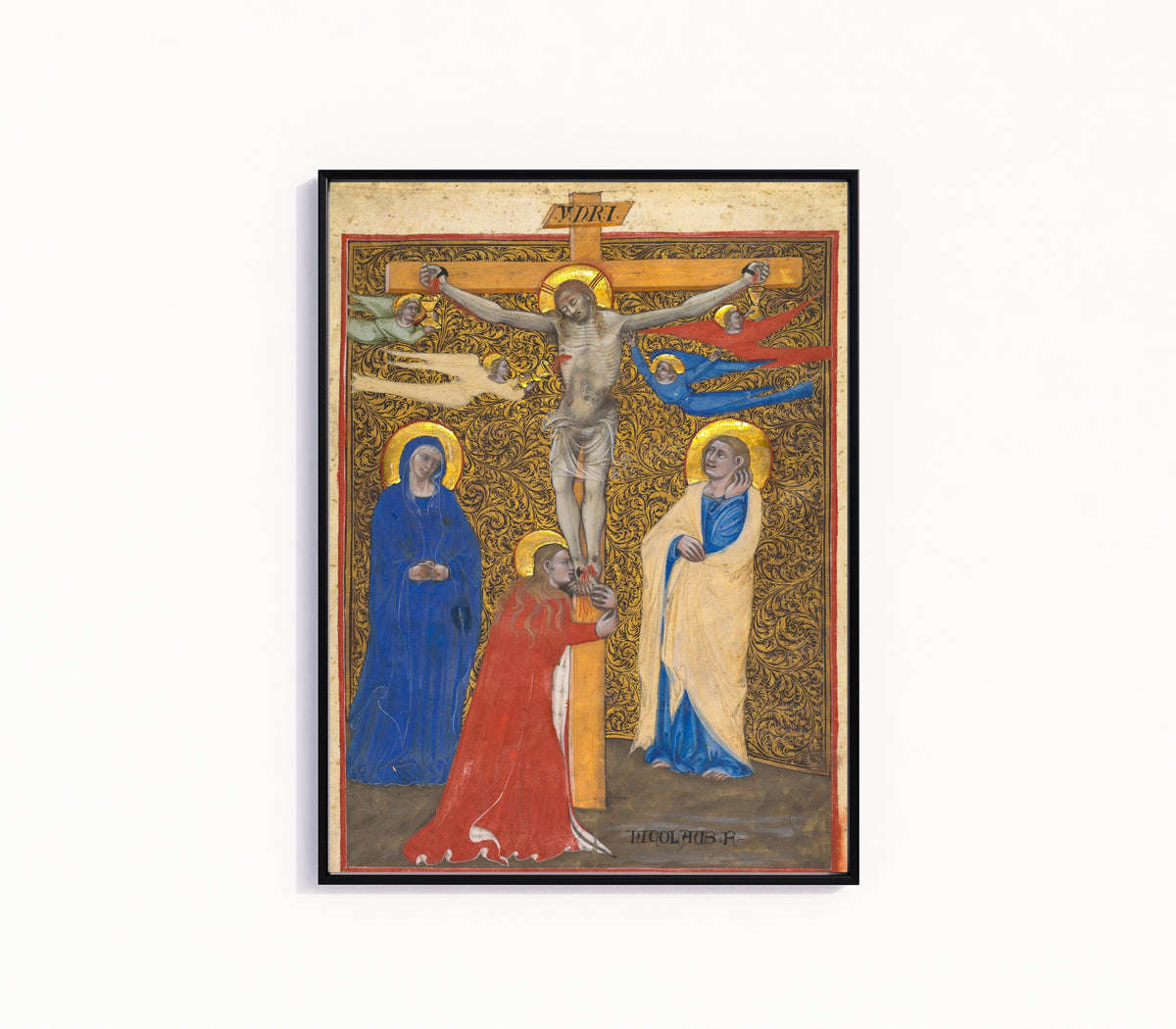 Framed art print of The Crucifixion by Niccolò di Giacomo da Bologna, in a slim black frame on a plain white wall