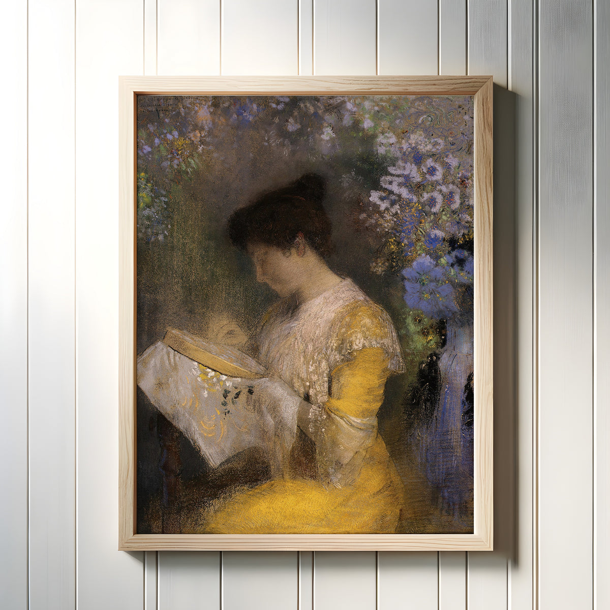 Framed art print of Madame Arthur Fontaine (Marie Escudier) by Odilon Redon, in a light wood frame on a white panelled wall