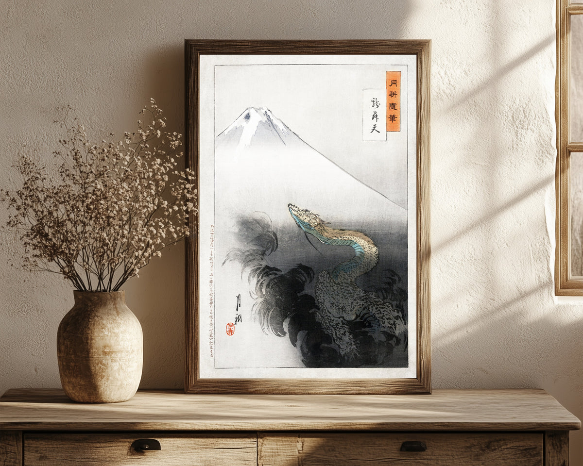 Framed art print of Ryū shōten (1897) by Ogata Gekkō, in a dark wood frame leaning on a rustic console beside dried flowers