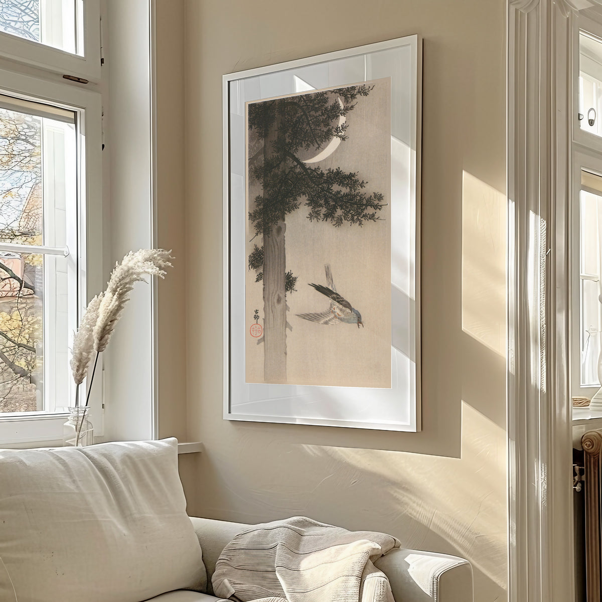 Alpine Accentor and Crescent Moon by Ohara Koson — shown framed on a wall