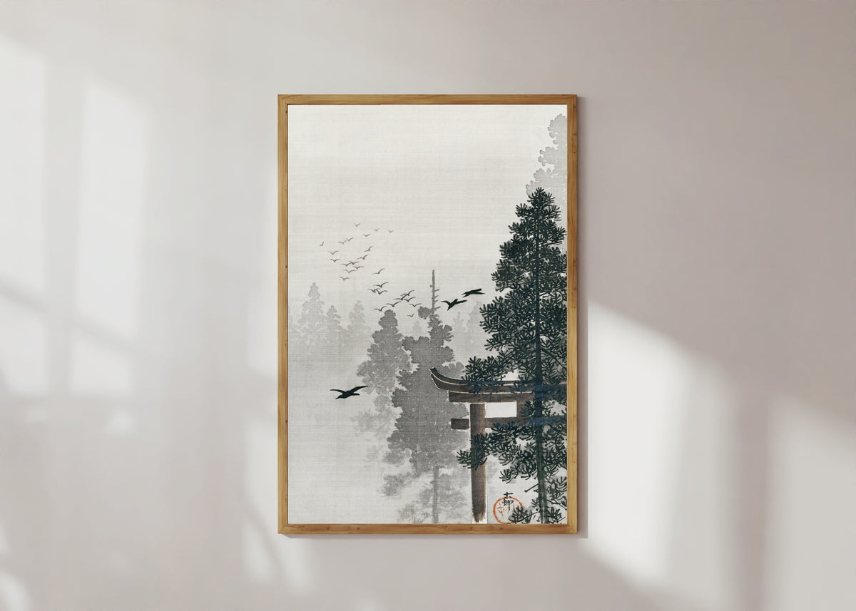 Framed art print of Flock of Birds and a Torii Gate in a Pine Forest by Ohara Koson, in a light wood frame on a sunlit white wall