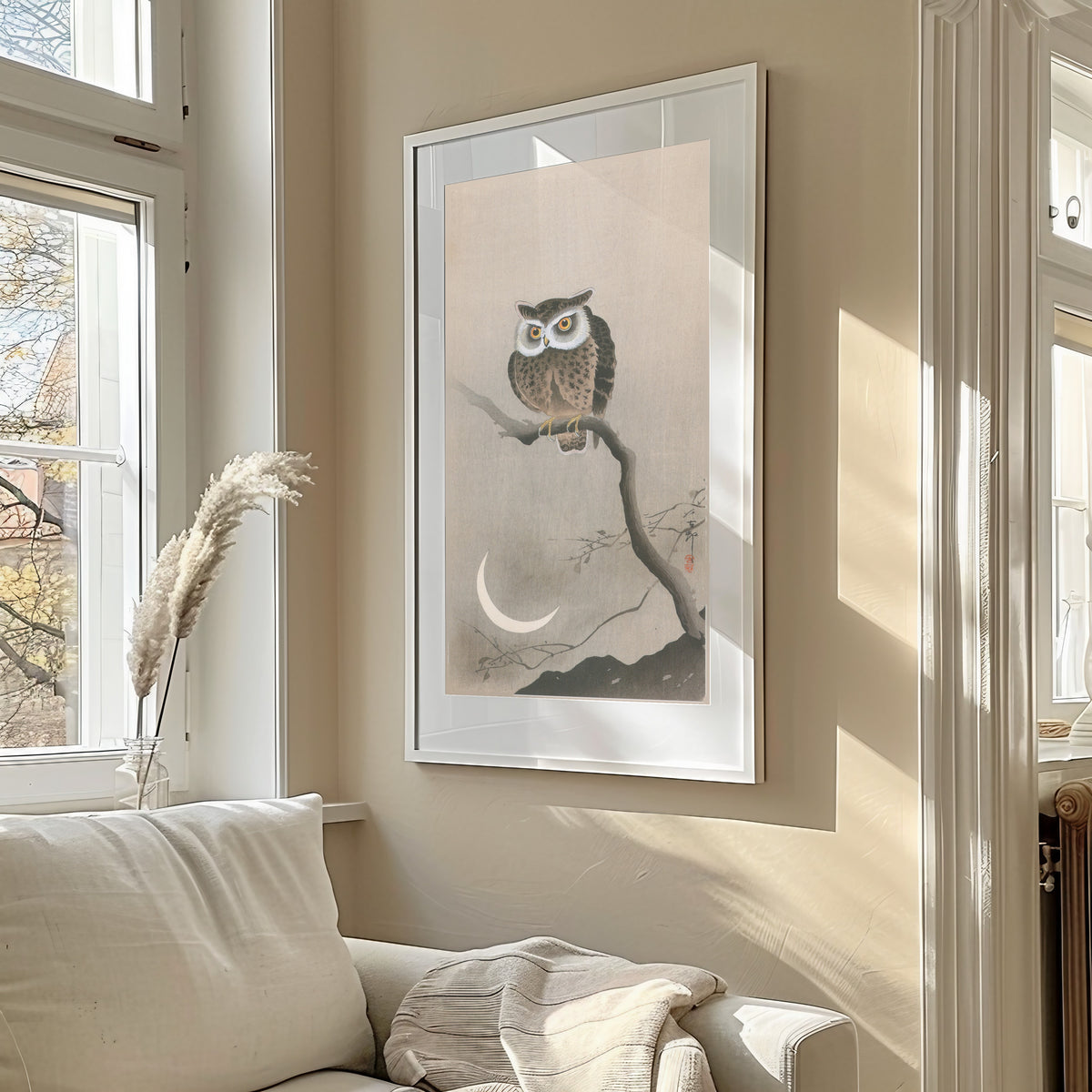 Horned Owl and Crescent Moon by Ohara Koson — shown framed on a wall