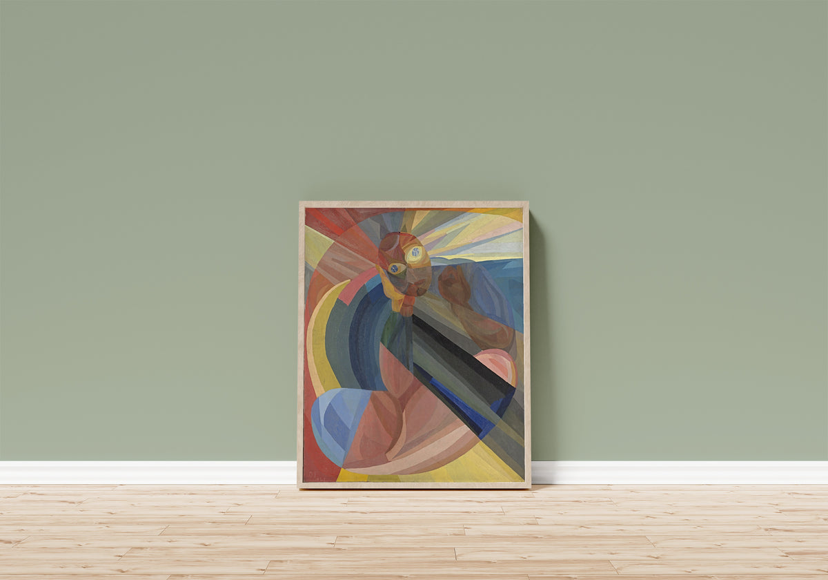 Framed art print of Die Mutter (1921) by Otto Freundlich, in a light wood frame leaning on a sage green wall above a wooden floor