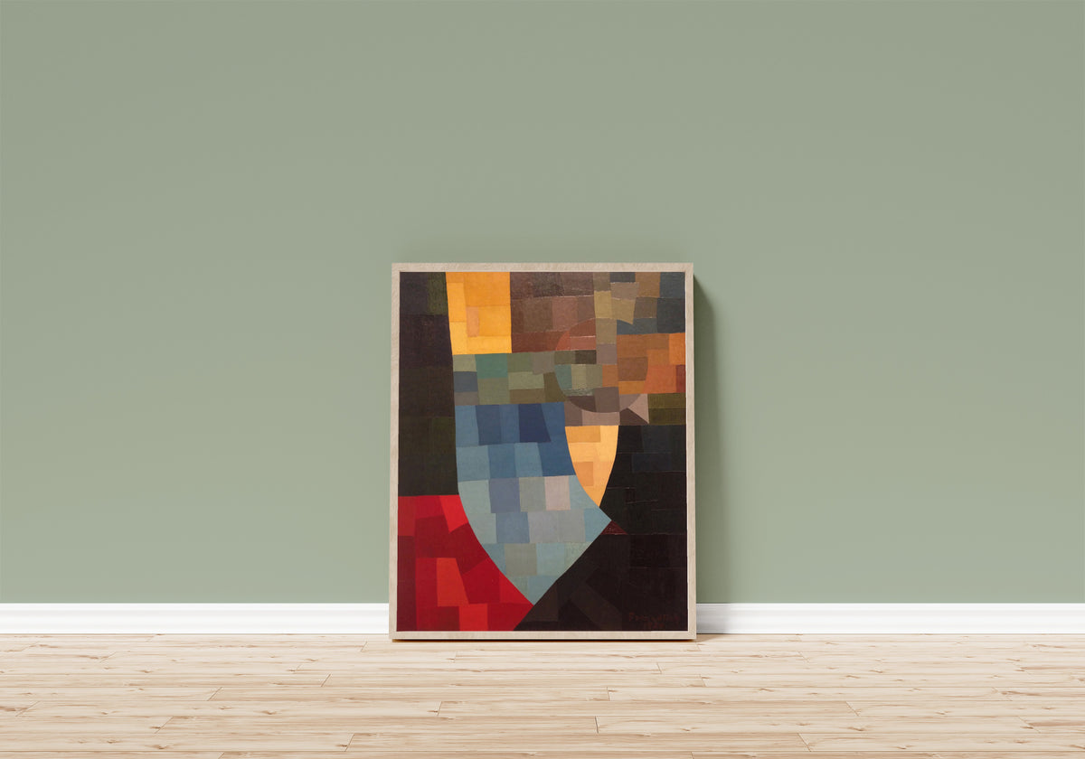 Framed art print of Komposition (1930) by Otto Freundlich, in a light wood frame leaning on a sage green wall above a wooden floor