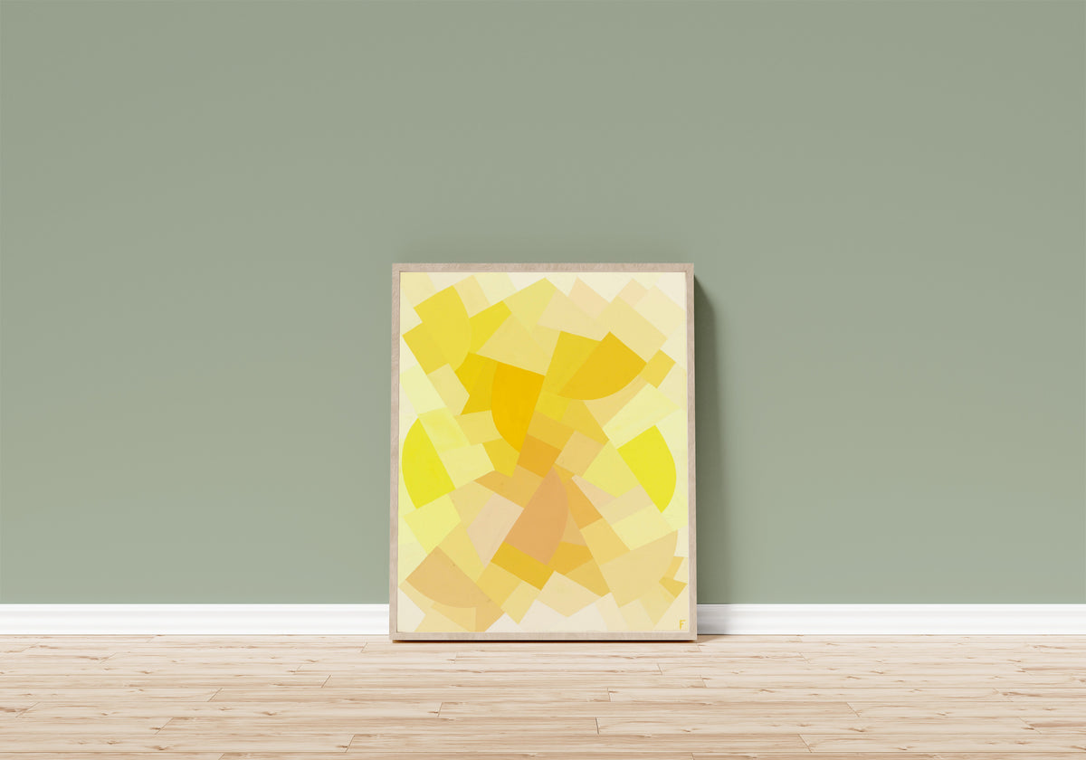 Framed art print of Komposition (1938) by Otto Freundlich, in a light wood frame leaning on a sage green wall above a wooden floor
