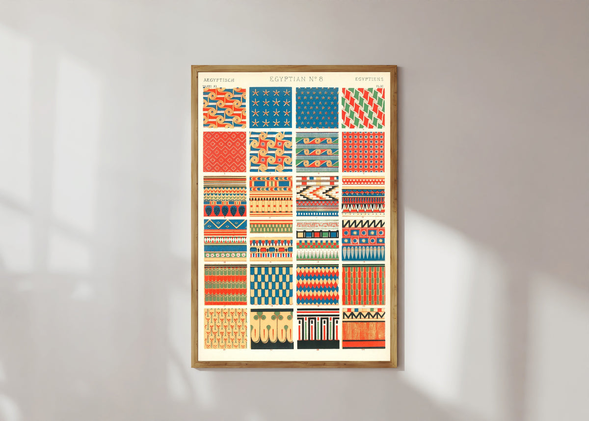 Framed art print of Egyptian by Owen Jones, in a light wood frame on a sunlit white wall