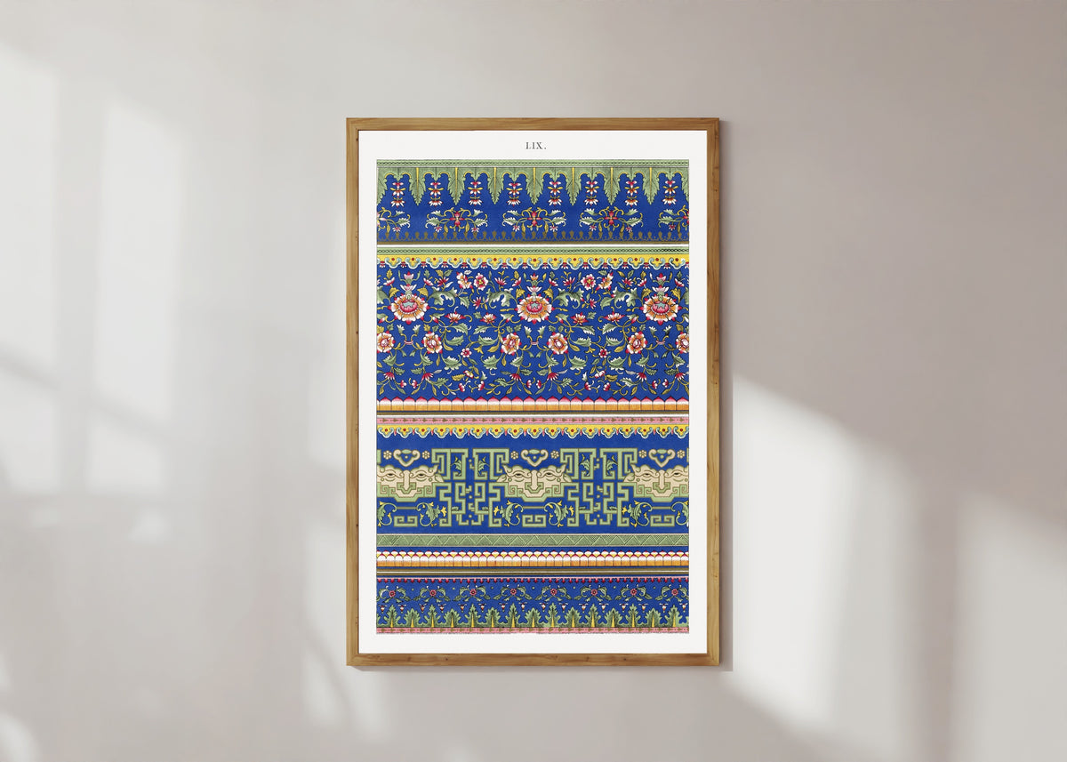 Framed art print of Example of Chinese Ornament Pl.53 (1867) by Owen Jones, in a light wood frame on a sunlit white wall