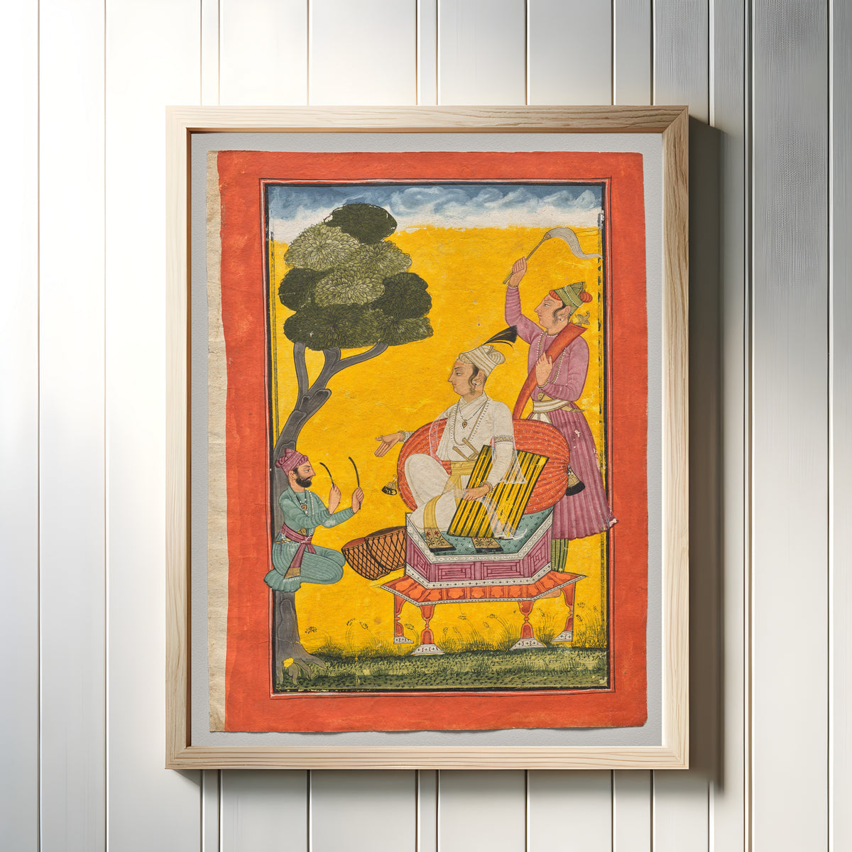 Framed art print of Vivacha Ragaputra, from a Ragamala by Pahari school, in a light wood frame on a white panelled wall