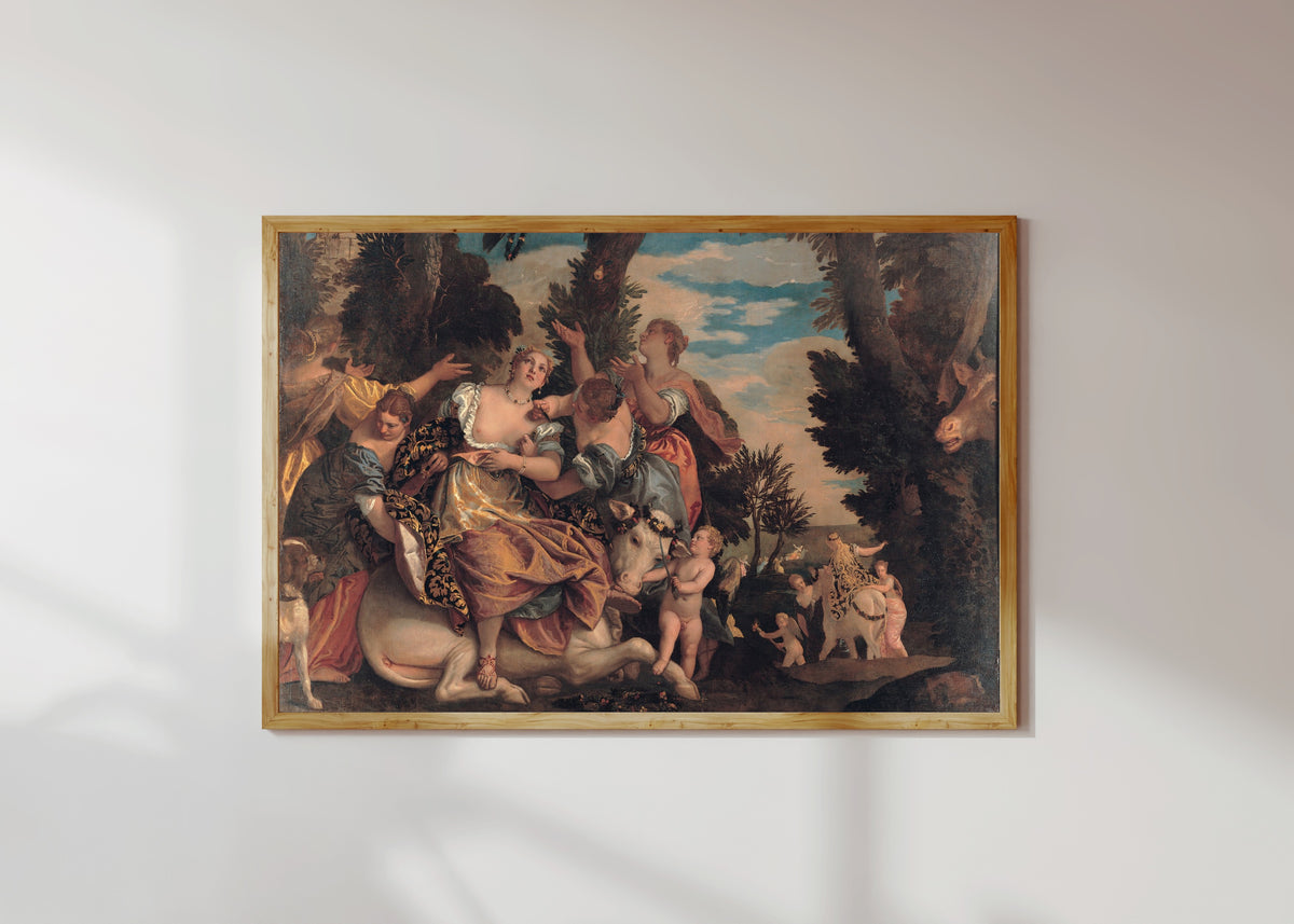 Framed art print of Rape of Europa by Paolo Veronese, in a light wood frame on a sunlit white wall