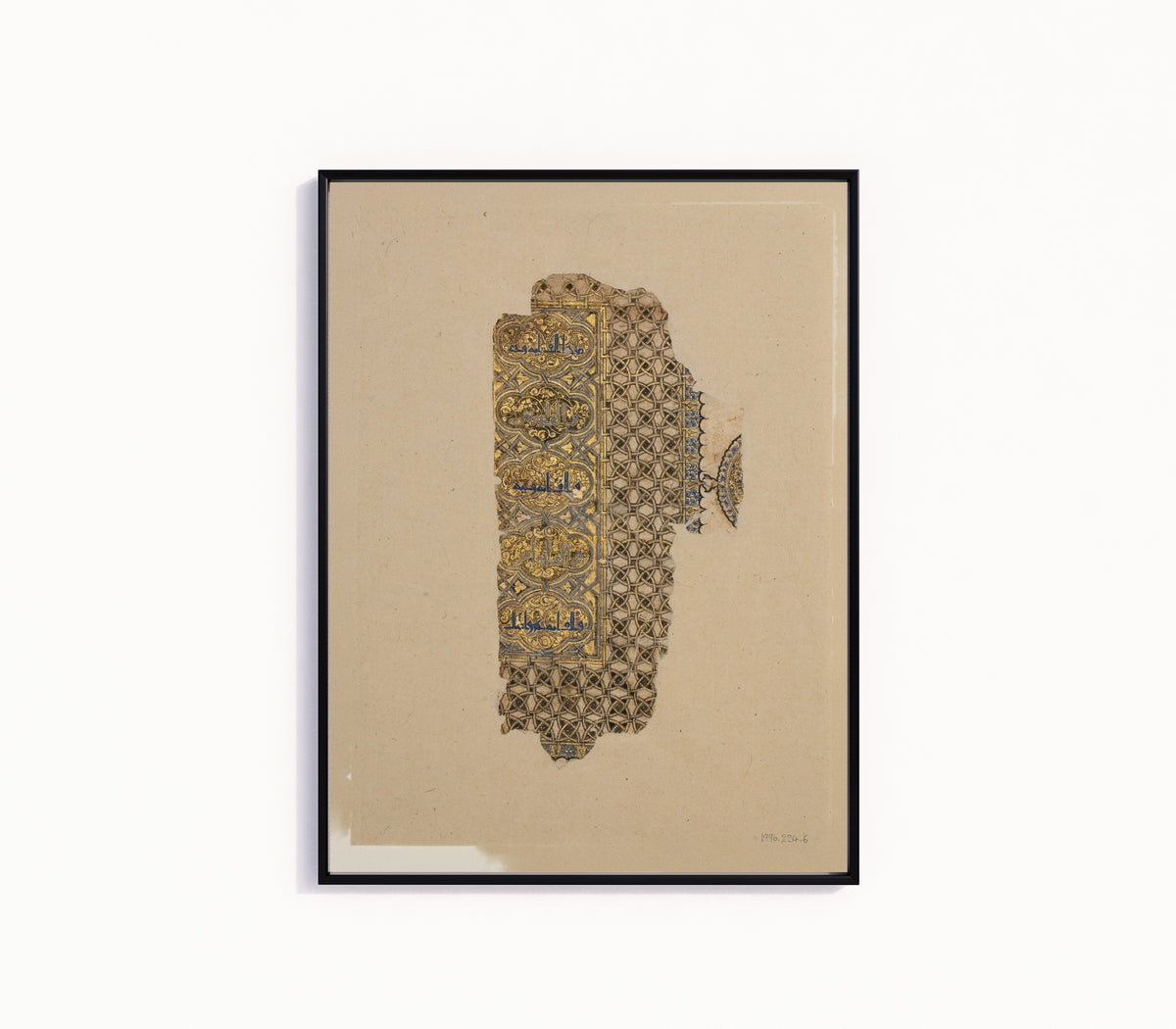 Framed art print of Fragment of a Folio from a Qur'an Manuscript by Muhammad al-Zanjani, in a slim black frame on a plain white wall