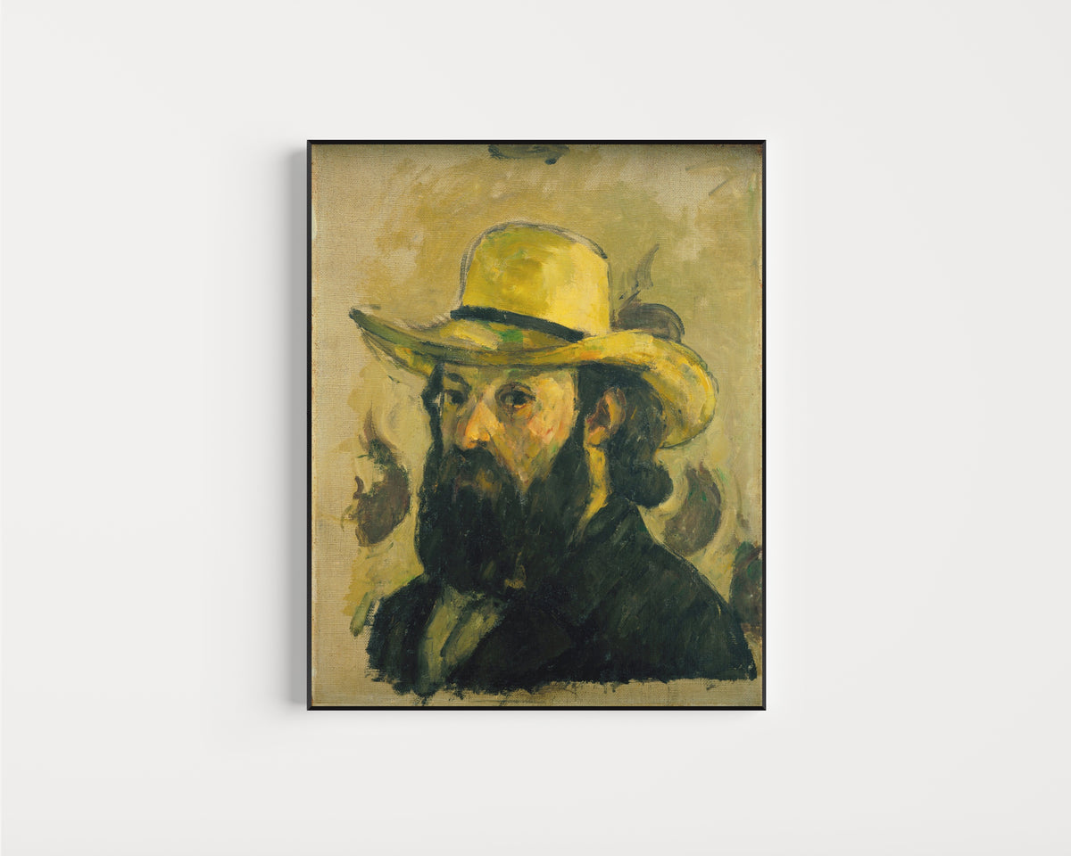 Framed art print of Self-Portrait in a Straw Hat by Paul Cezanne, in a slim black frame on a plain white wall