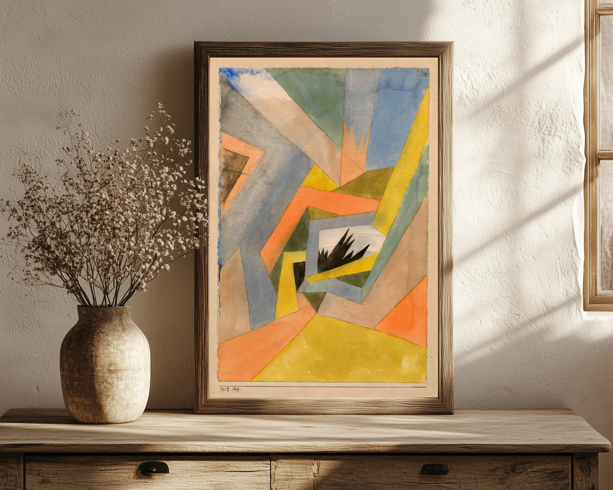 Framed art print of The Idea of Firs by Paul Klee, in a dark wood frame leaning on a rustic console beside dried flowers