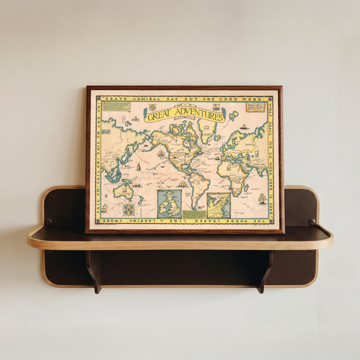 Framed art print of Map of Great Adventures by Paul Mayo Paine, in a dark wood frame resting on a wall shelf