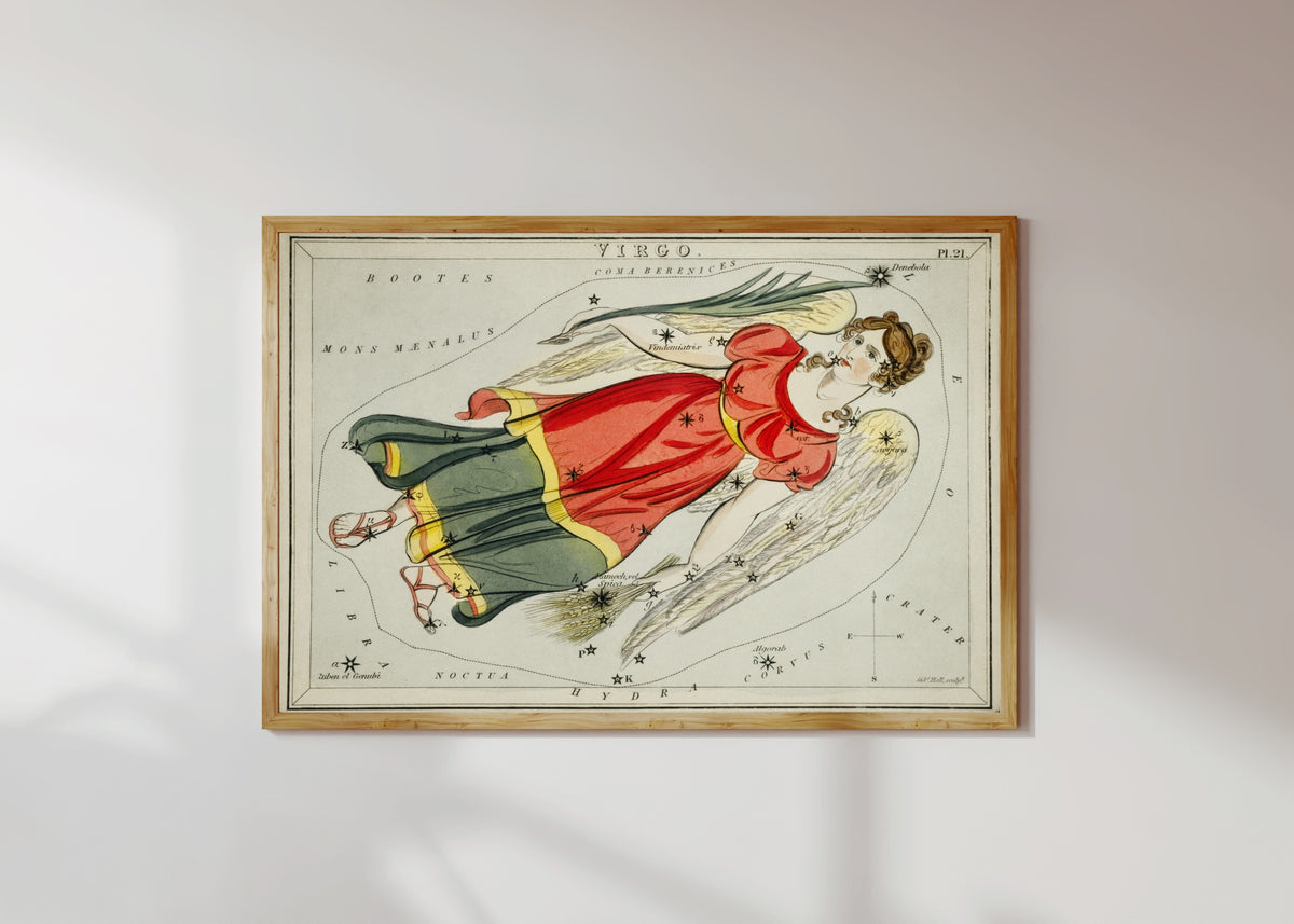 Framed art print of Virgo by Sidney Hall, in a light wood frame on a sunlit white wall