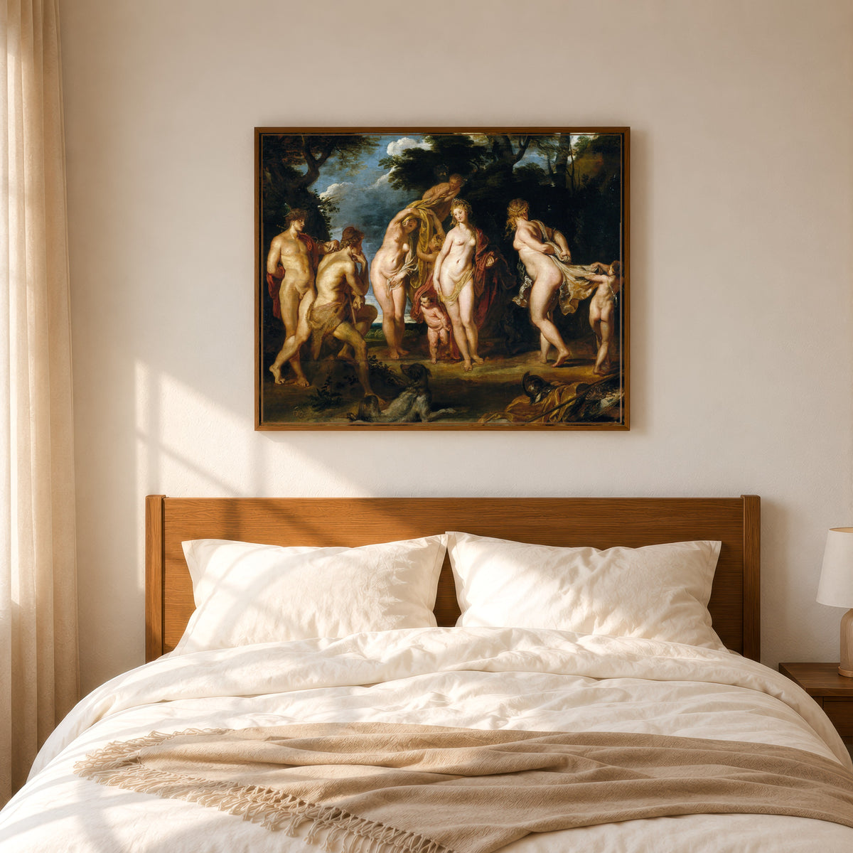 Framed art print of The Judgement of Paris by Peter Paul Rubens, in a slim wood frame above a bed in a sunlit bedroom