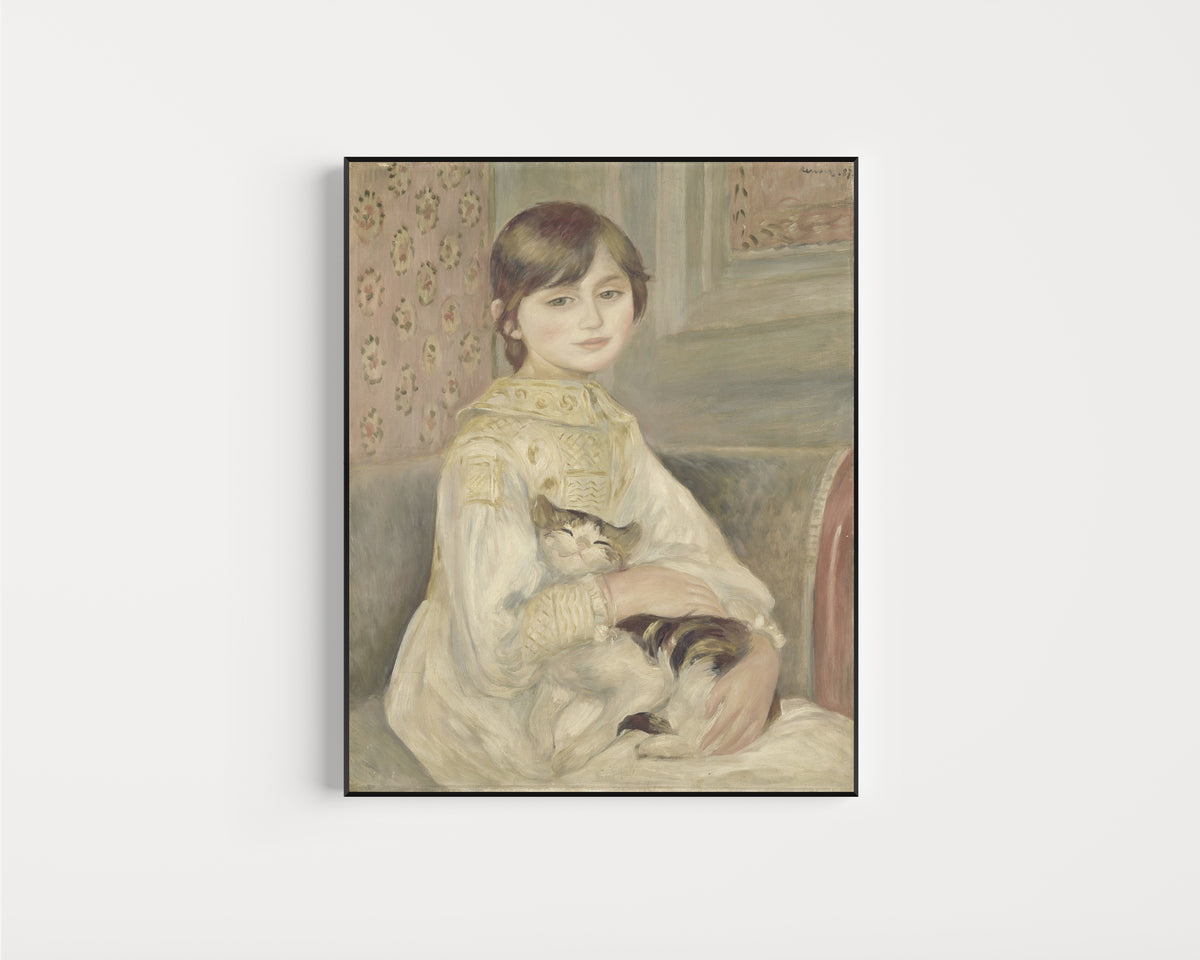 Framed art print of Julie Manet by Pierre-Auguste Renoir, in a slim black frame on a plain white wall
