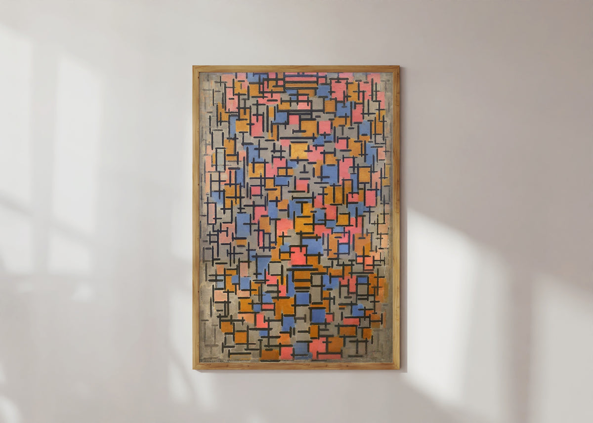 Framed art print of Composition by Piet Mondrian, in a light wood frame on a sunlit white wall