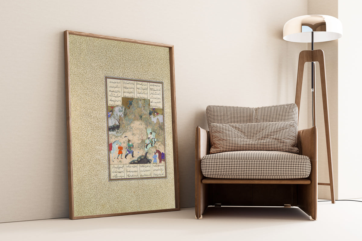 Framed art print of Shahnama of Shah Tahmasp: The Final Joust of the… by Qasim ibn Ali (attributed), leaning against a wall beside an armchair and a floor lamp