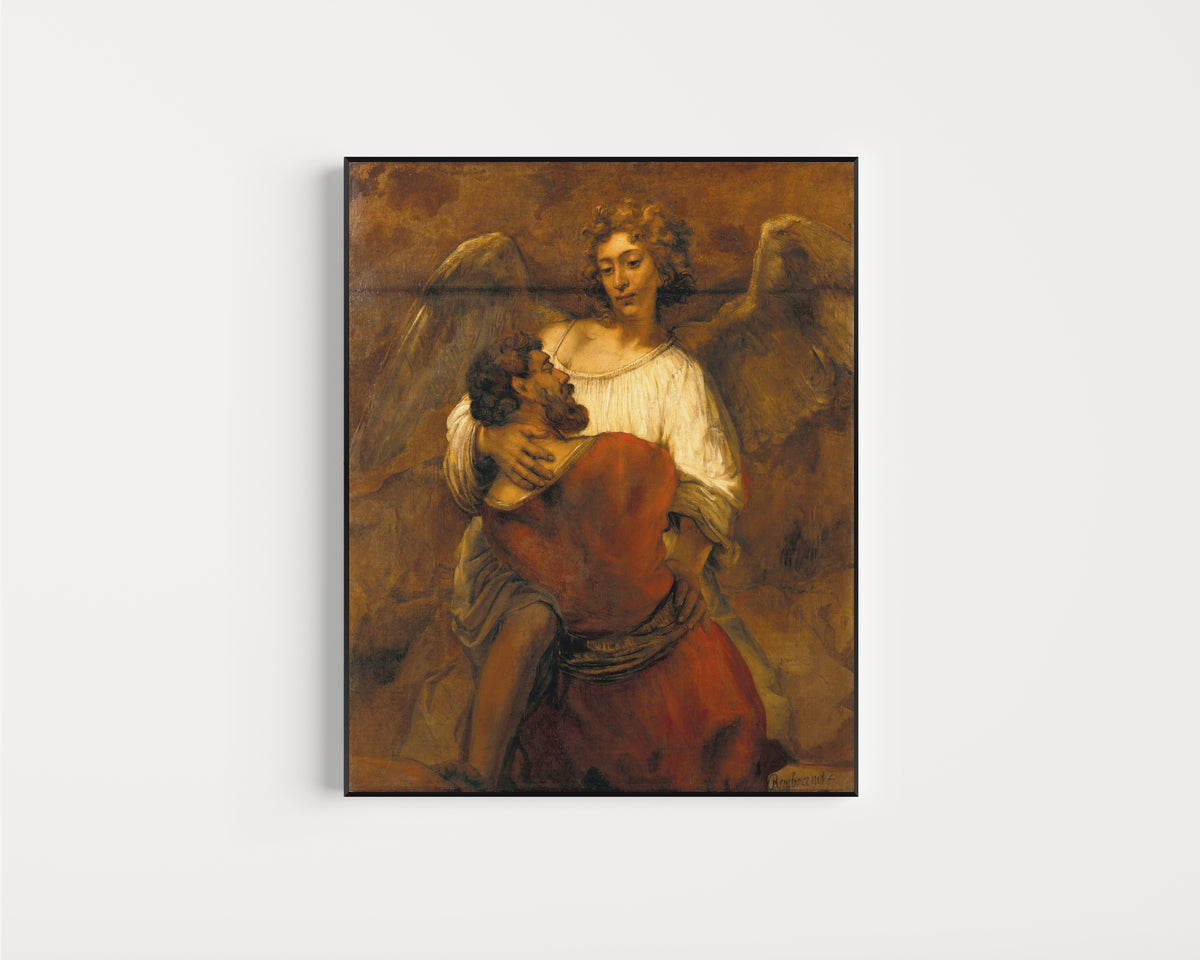 Framed art print of Jacob Wrestling with the Angel by Rembrandt van Rijn, in a slim black frame on a plain white wall