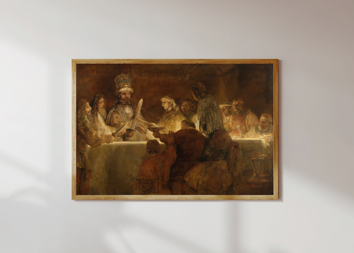Framed art print of The Conspiracy of the Batavians under Claudius Civilis by Rembrandt van Rijn, in a light wood frame on a sunlit white wall