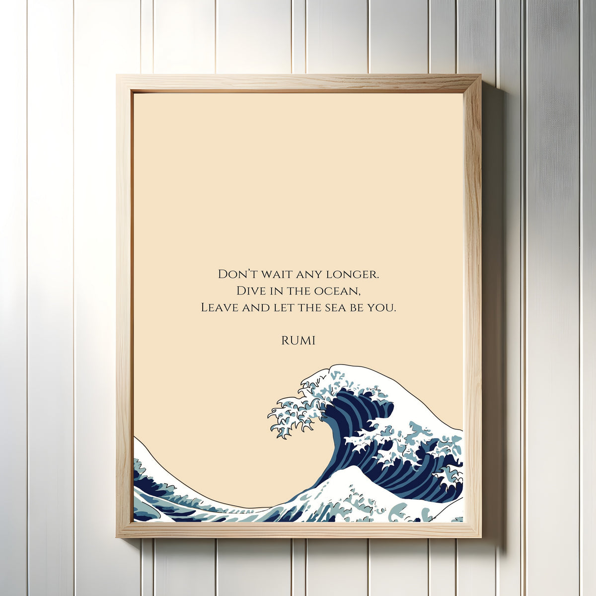 Framed art print of Wave by Rumi, in a light wood frame on a white panelled wall