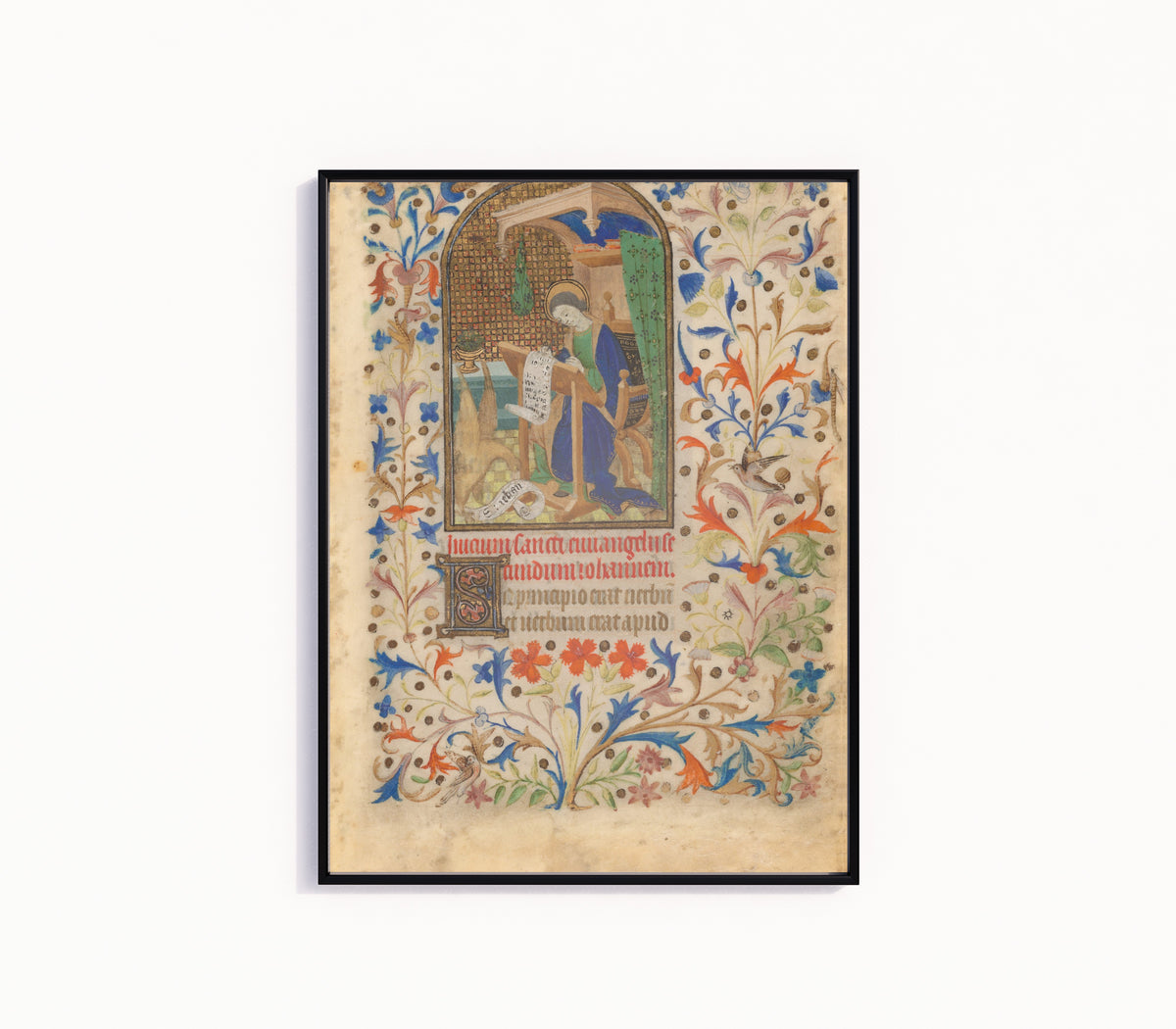 Framed art print of Saint John, in a slim black frame on a plain white wall
