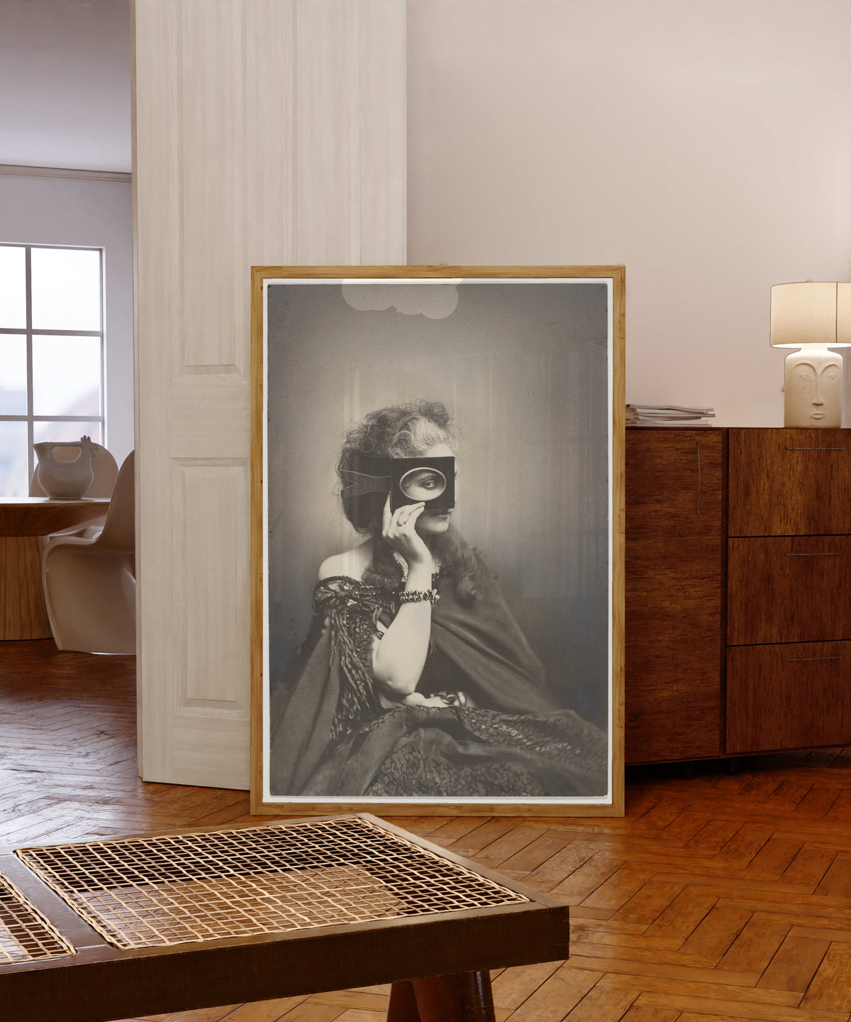 Framed art print of Scherzo di Follia by Pierre-Louis Pierson, in a light wood frame leaning in a warm room with a parquet floor