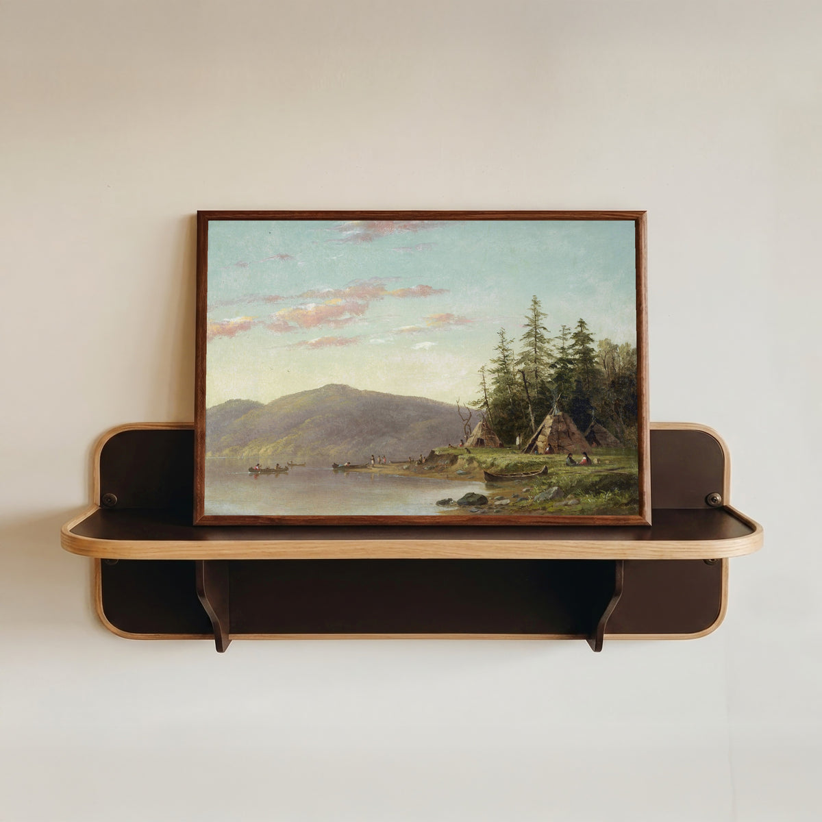 Framed art print of Chippewa Encampment on the Upper Mississippi by Seth Eastman, in a dark wood frame resting on a wall shelf