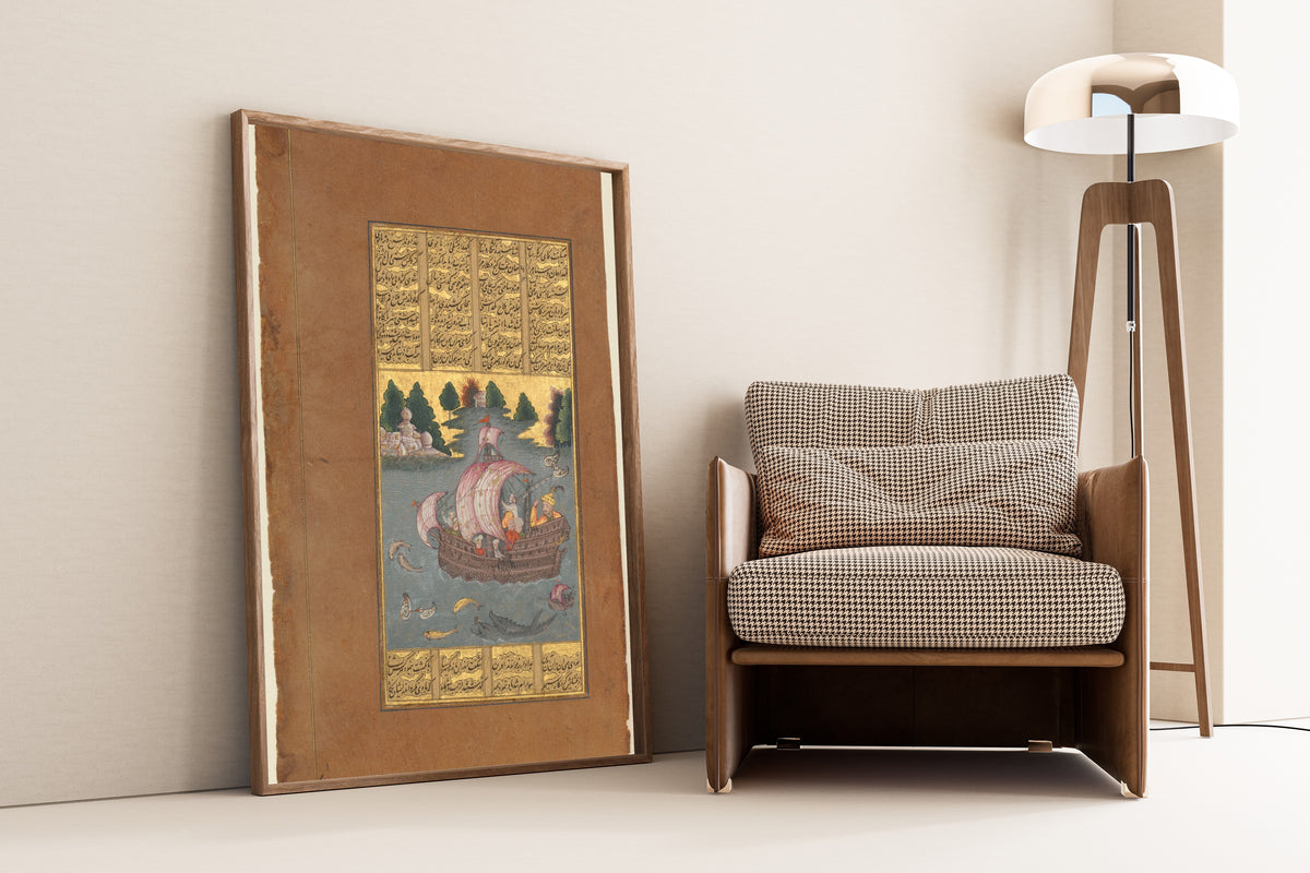 Kai Khusrau Crosses the Sea by Shahnameh (Firdausi) — framed and leaning against a wall beside an armchair and a floor lamp