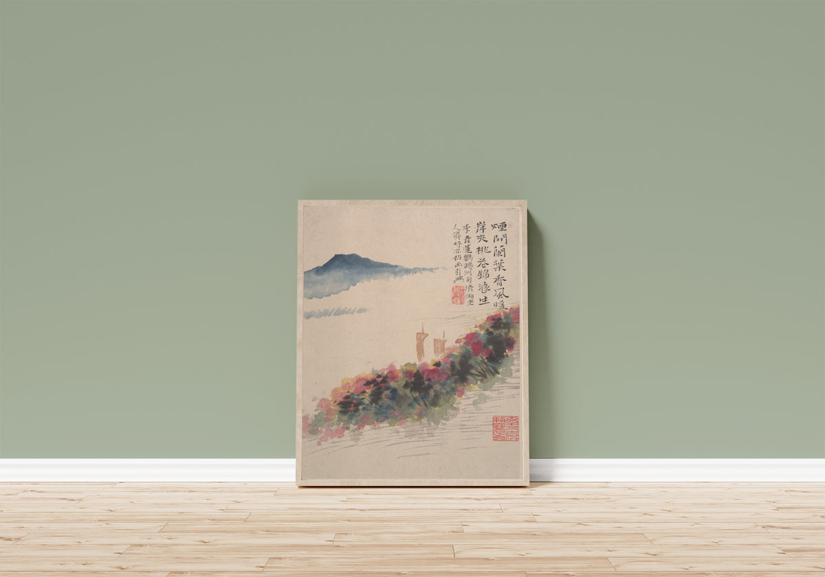 Framed art print of Wilderness Colors (Peach Blossom Bank and Two Sails) by Shitao, in a light wood frame leaning on a sage green wall above a wooden floor