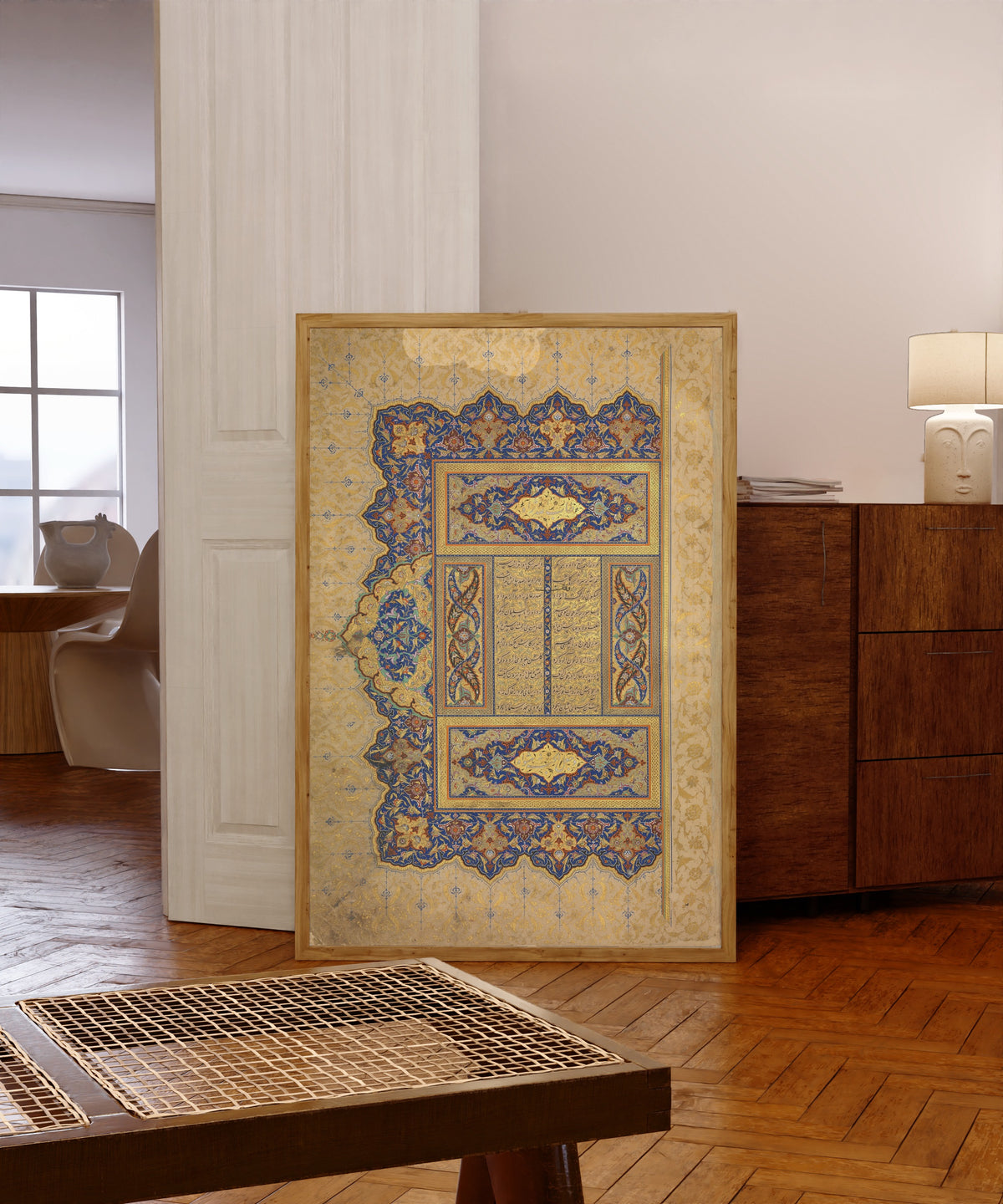 Framed art print of Illuminated Frontispiece of a Manuscript of… by Sultan 'Ali al-Mashhadi, in a light wood frame leaning in a warm room with a parquet floor