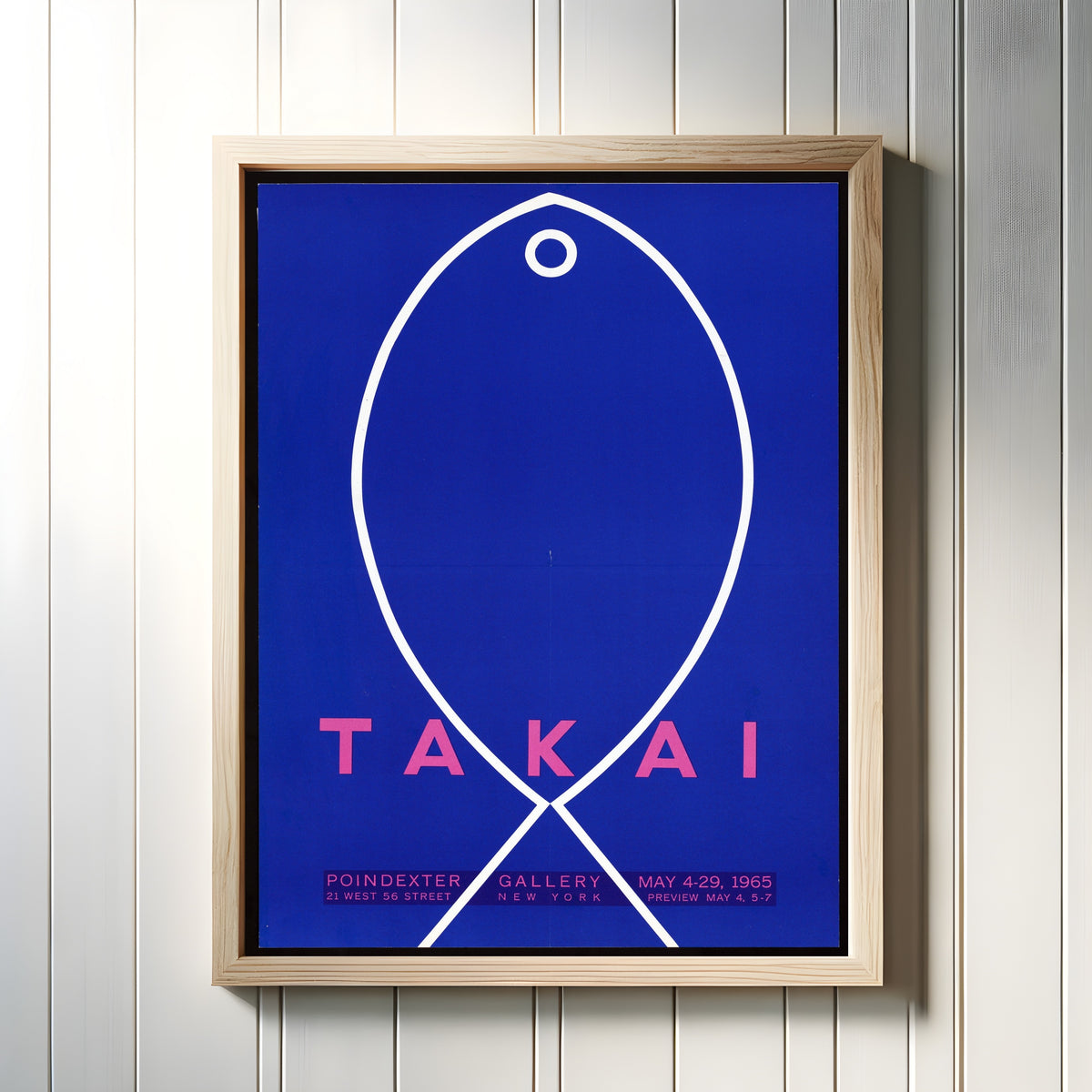 Framed art print of Fish by Teiji Takai, in a light wood frame on a white panelled wall