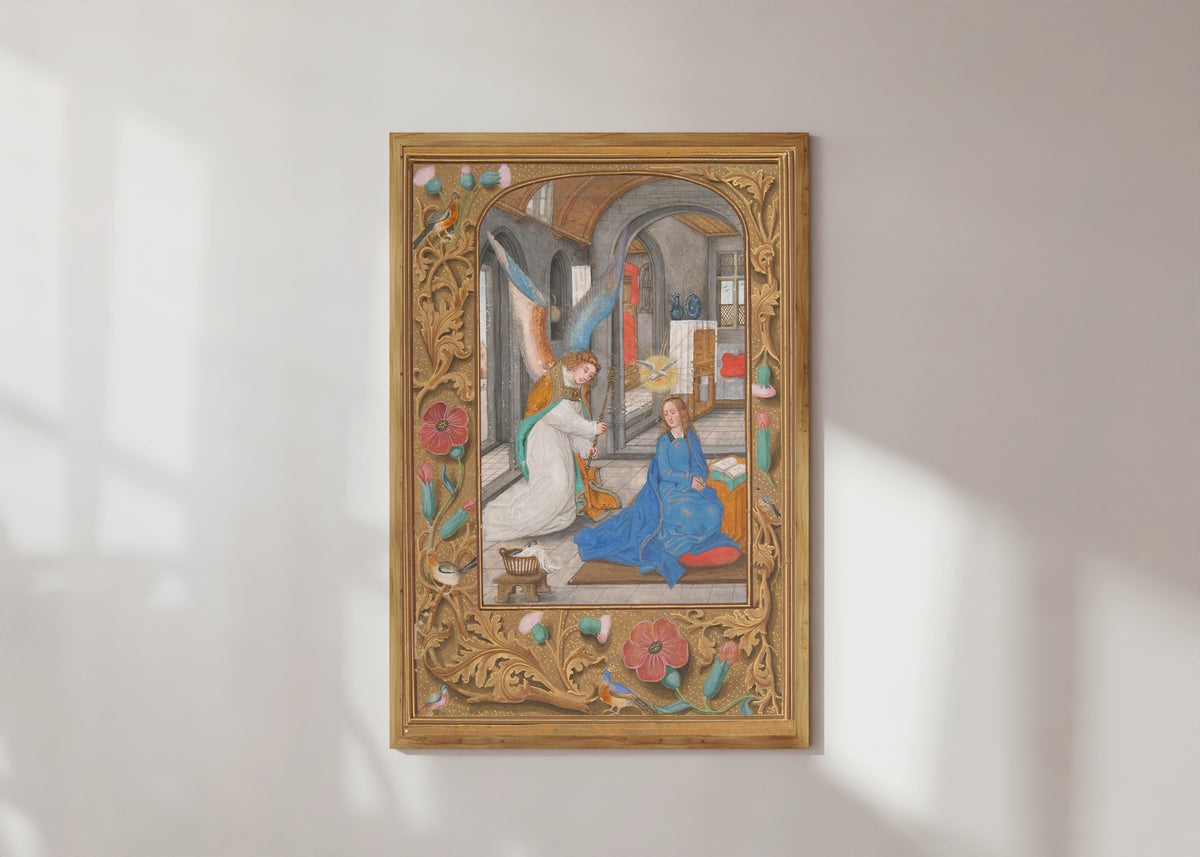 Framed art print of The Annunciation (Grey Stone Room), in a light wood frame on a sunlit white wall