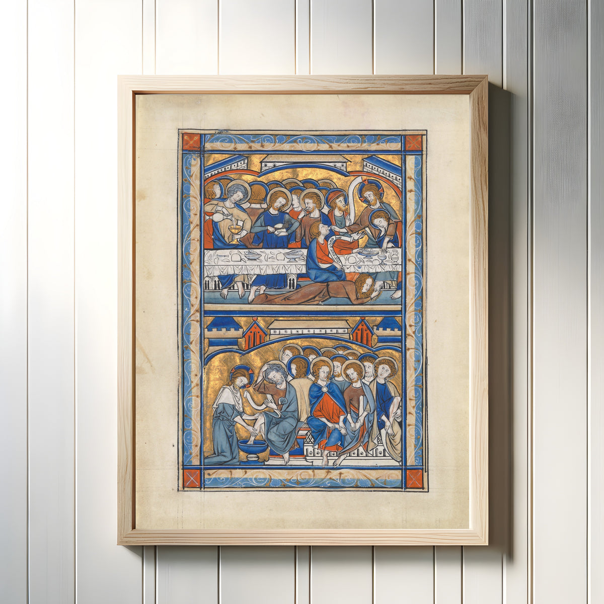 Framed art print of The Last Supper and the Washing of the Apostles' Feet, in a light wood frame on a white panelled wall
