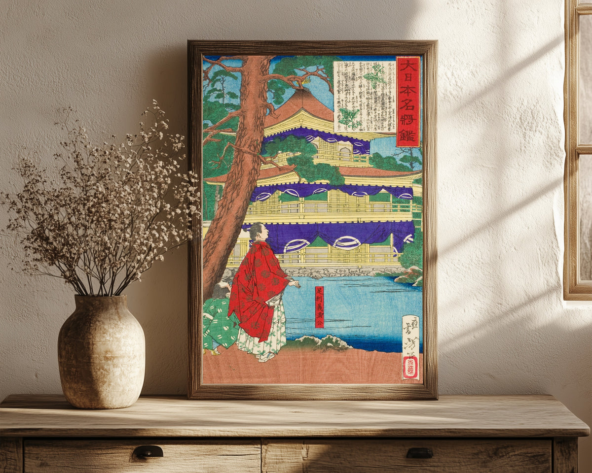 Framed art print of Ashikaga Yoshimitsu Admiring the Golden… by Tsukioka Yoshitoshi, in a dark wood frame leaning on a rustic console beside dried flowers
