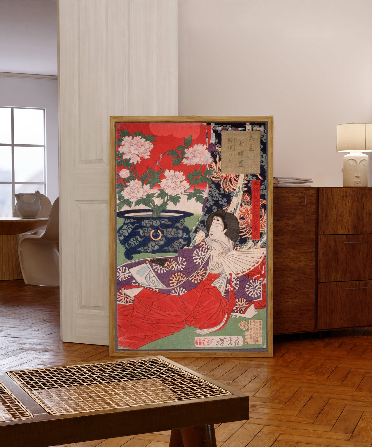 Framed art print of Earth for the Potted Plant by Tsukioka Yoshitoshi, in a light wood frame leaning in a warm room with a parquet floor