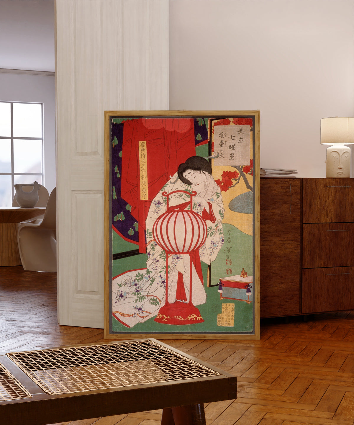 Framed art print of Full Moon by Tsukioka Yoshitoshi, in a light wood frame leaning in a warm room with a parquet floor